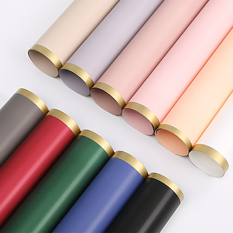 Papel de regalo de flores con película nacarada sólida con borde dorado MYHC-27