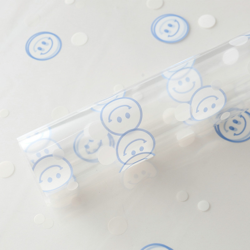 Papel de regalo de flores con cara sonriente de celofán OPP