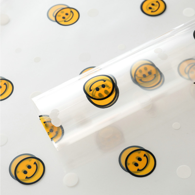 Papel de regalo de flores con cara sonriente de celofán OPP